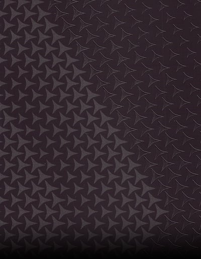 detailed-view-of-a-black-background-with-a-star-pattern-overlay